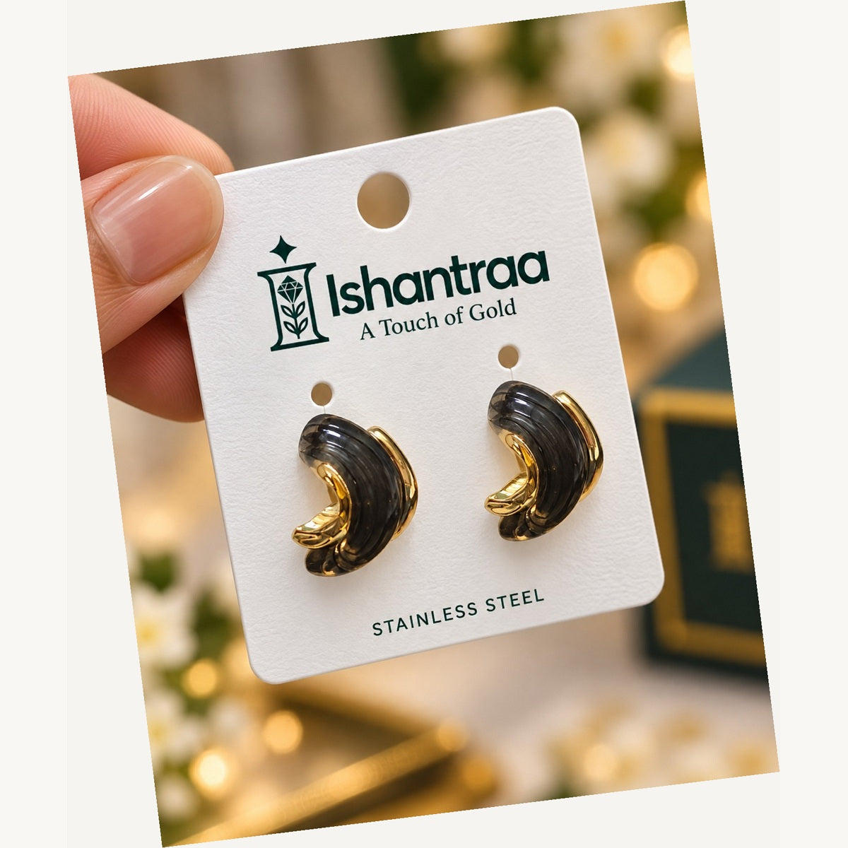 ISHANTRAA Gold Touch Black and Gold Curve Stainless Steel Earrings - angled view