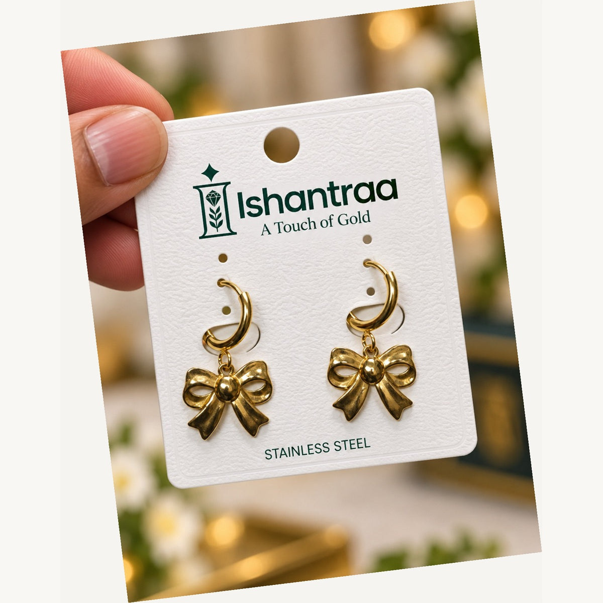 ISHANTRAA Gold Touch Bow Drop Stainless Steel Earrings - angled view
