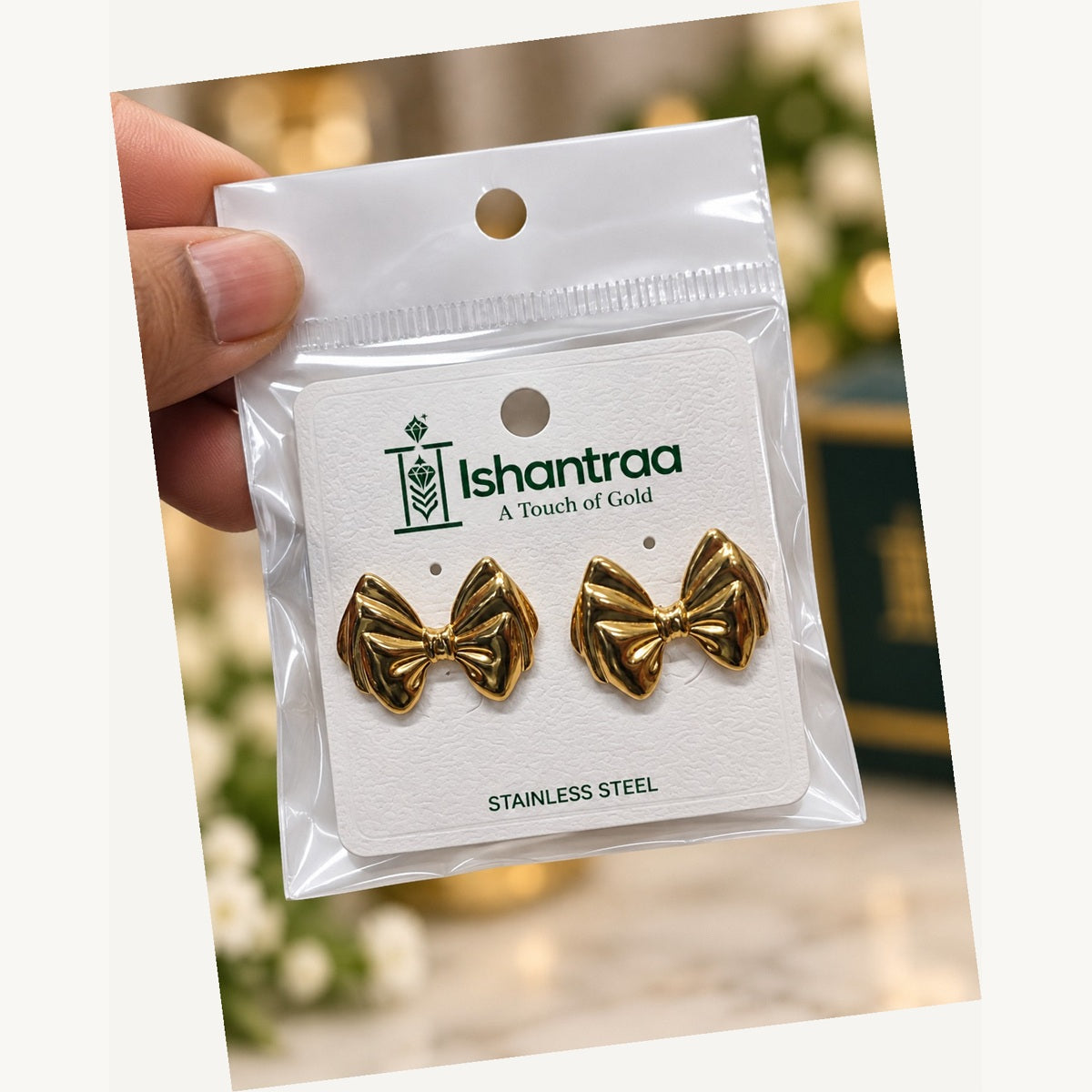 ISHANTRAA Gold Touch Bow Stud Stainless Steel Earrings - angled view