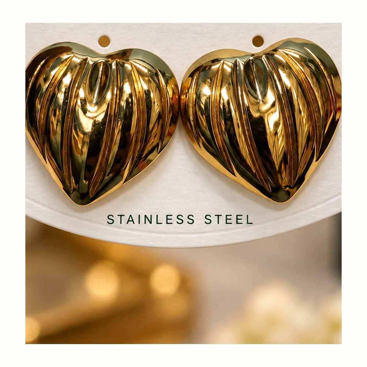 ISHANTRAA Gold Touch Heart Statement Stainless Steel Earrings - close-up