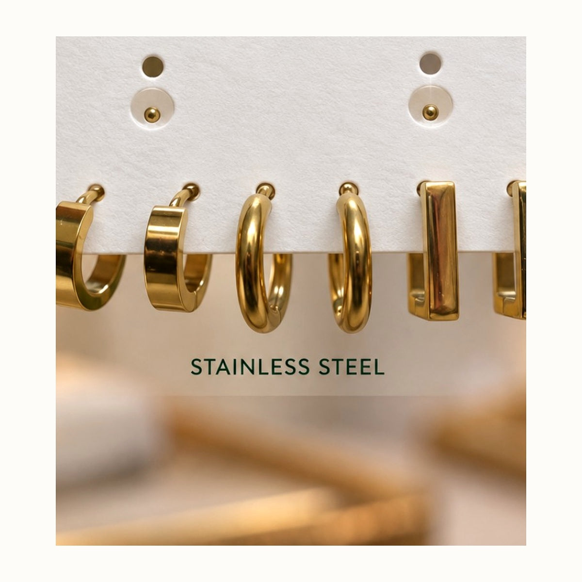 ISHANTRAA Gold Touch Twisted Hoop Stainless Steel Earrings - close-up